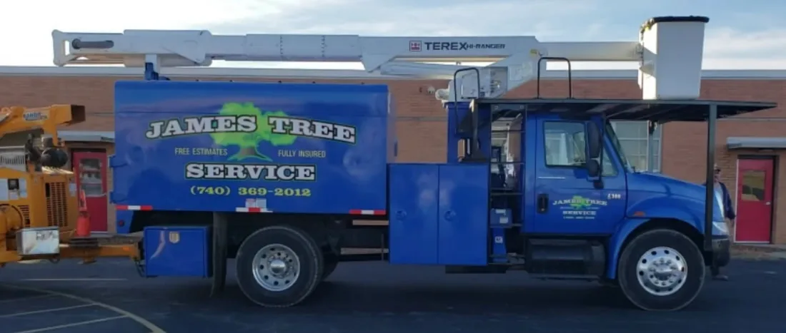 The blue James Tree Service truck Delaware has known for decades